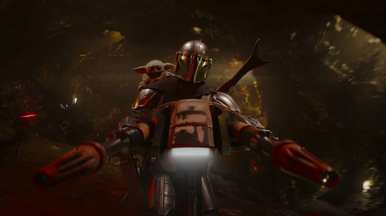 O Mandaloriano e Grogu em cena de ação do filme de Star Wars