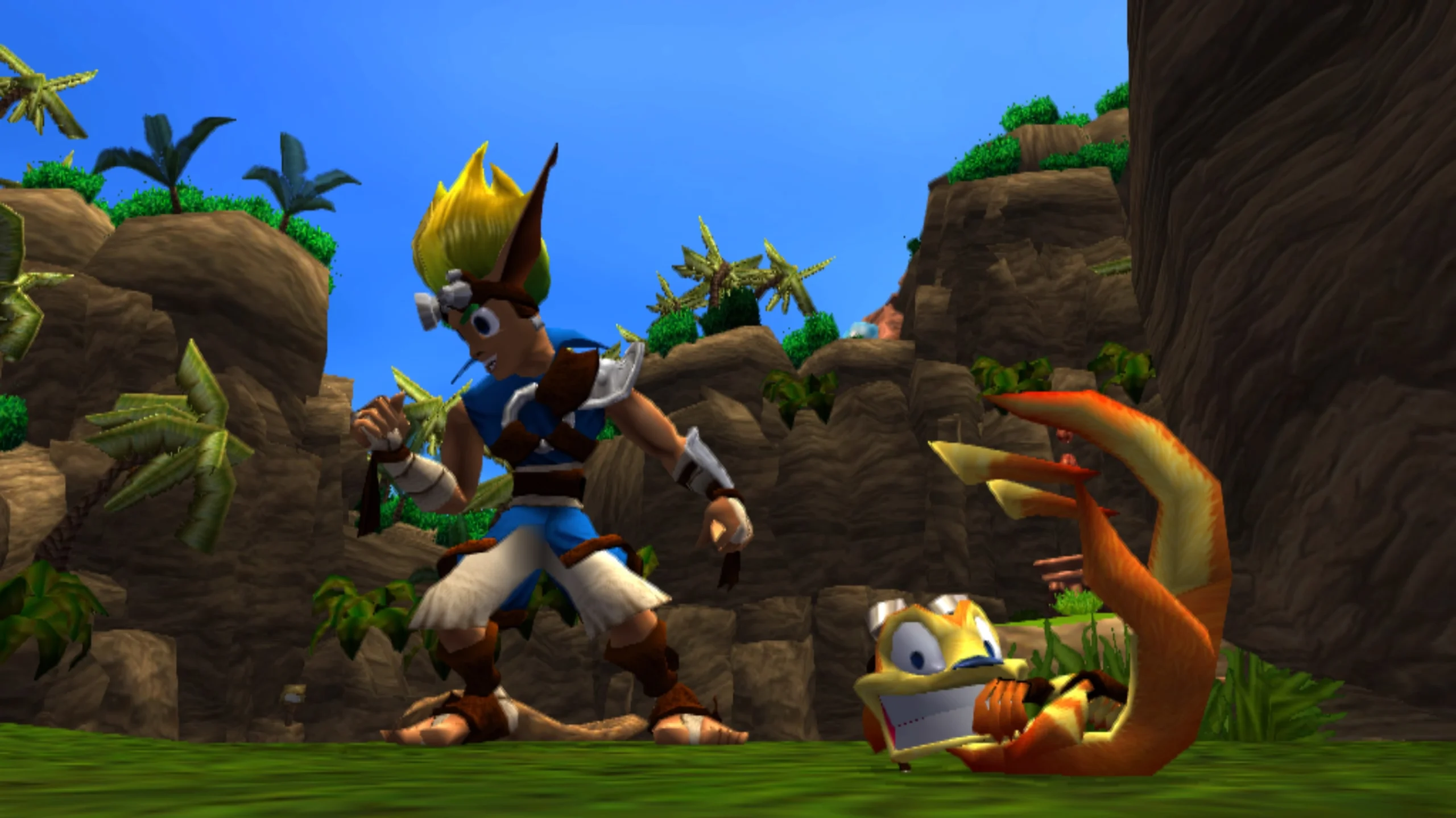 Jak e Daxter em uma área de vegetação e paredões rochosos em The Precursor Legacy.