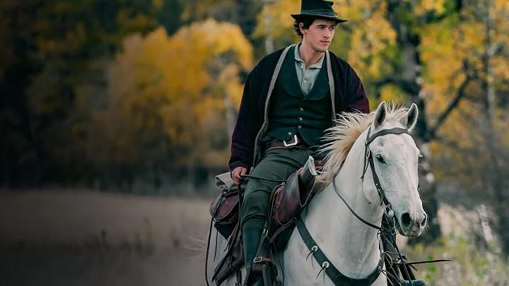 Tom Blyth montado em cavalo branco como Billy the Kid