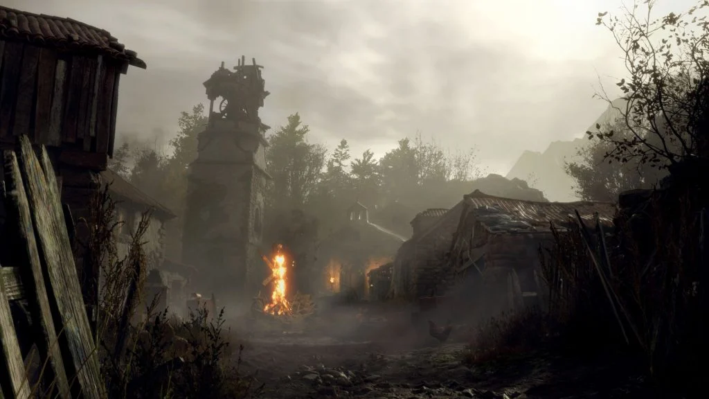 Aldeia de Resident Evil 4 Remake com casas e uma fogueira no centro