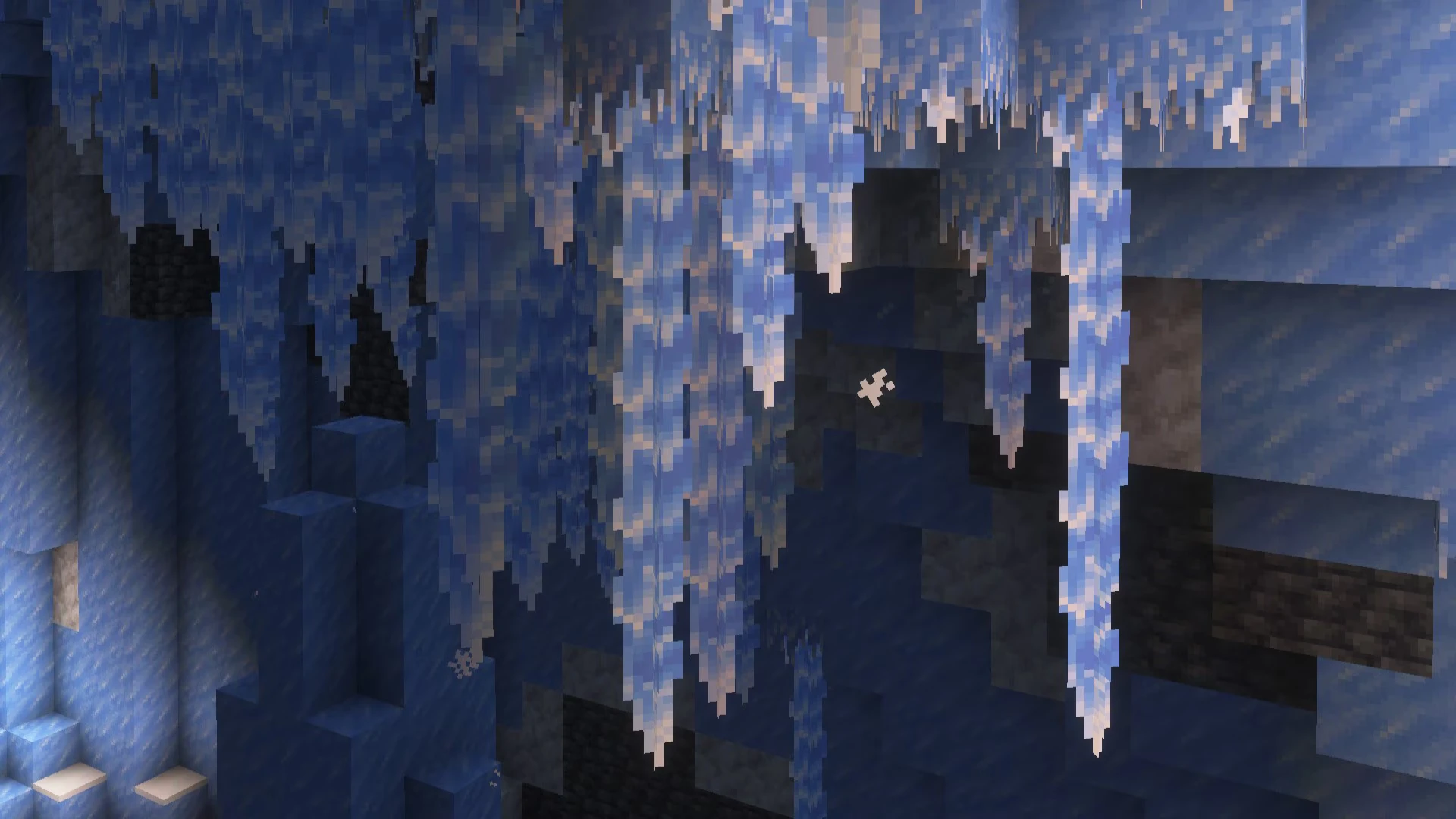 Formações de gelo penduradas no teto de uma caverna de Minecraft
