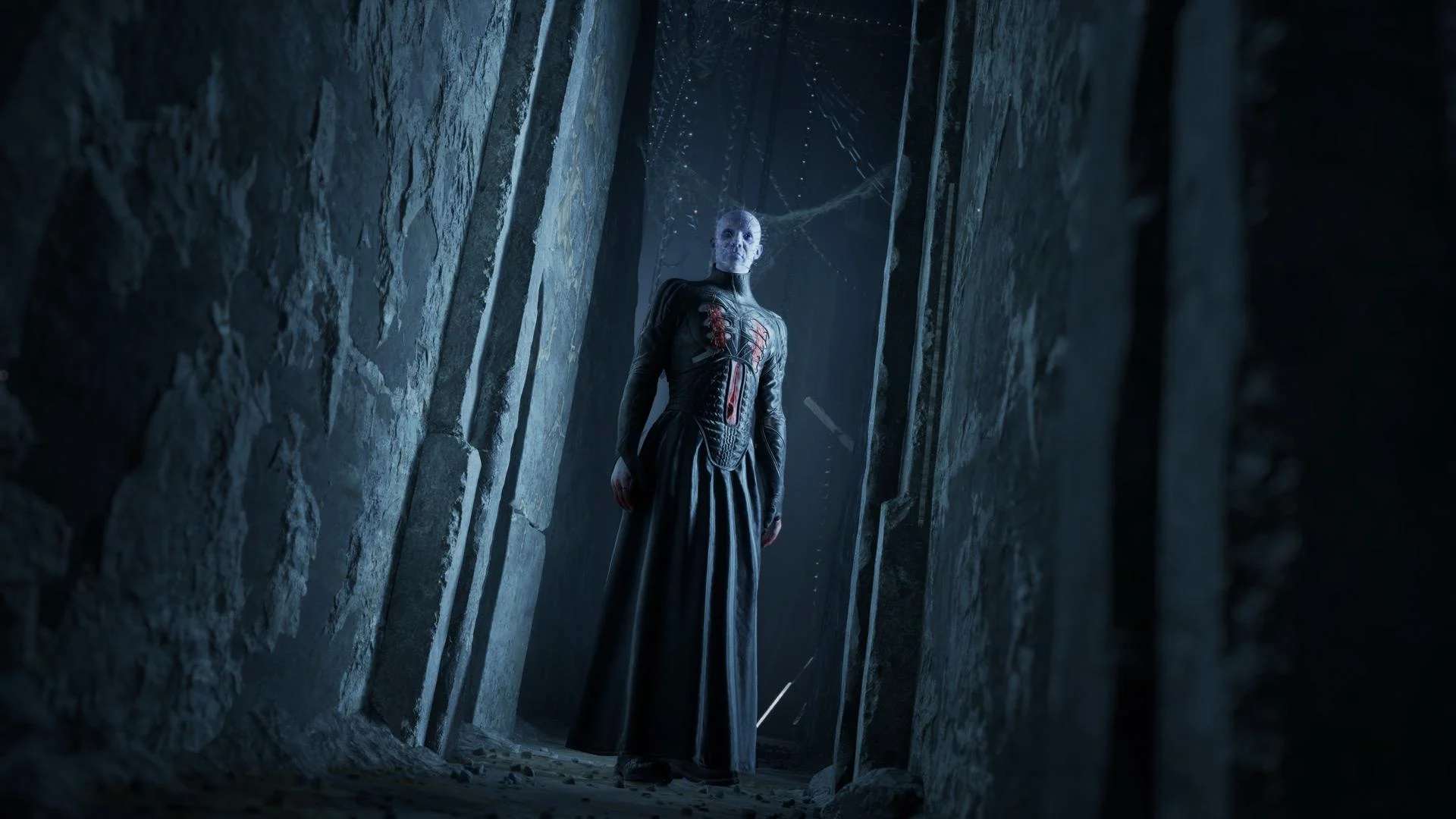 Pinhead aparece em um corredor sombrio de pedra em Clive Barker's Hellraiser: Revival