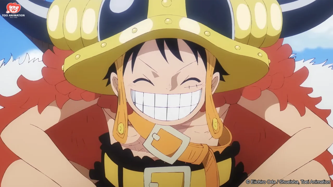 Monkey D. Luffy sorrindo com capacete e roupas do arco de Elbaph em One Piece