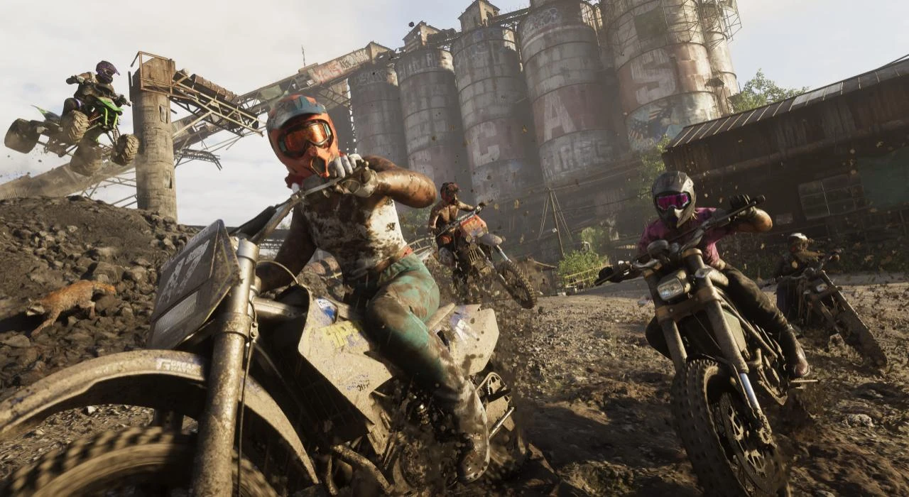 Competidores disputam uma corrida off-road de motocicletas em terreno enlameado de GTA 6, próximo a instalações industriais